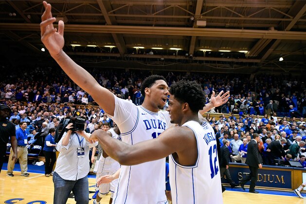 DURHAM, NC - FEBRUARY 18:  Jahlil Okafor #15 and Justise Winslow #12 of the Duke Blue Devils celebrate after a win against the North Carolina Tar Heels  at Cameron Indoor Stadium on February 18, 2015 in Durham, North Carolina. Duke won 92-90 in overtime.  (Photo by Grant Halverson/Getty Images)