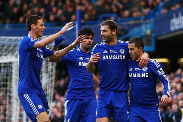 LONDON, ENGLAND - FEBRUARY 21:  Branislav Ivanovic (2nd R) of Chelsea is congratulated by teammates after scoring the opening goal during the Barclays Premier League match between Chelsea and Burnley at Stamford Bridge on February 21, 2015 in London, England.  (Photo by Paul Gilham/Getty Images)