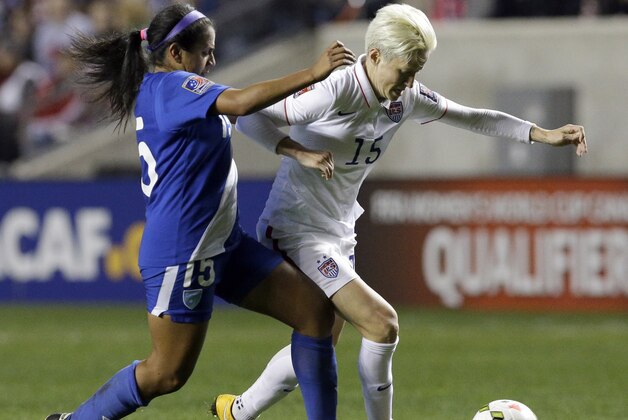 United States' Megan Rapinoe, right, controls the ball against Guatemala's Christian Recinos during the first half of a CONCACAF Women's Championship soccer game Friday, Oct. 17, 2014, in Bridgeview, Ill. (AP Photo/Nam Y. Huh)
