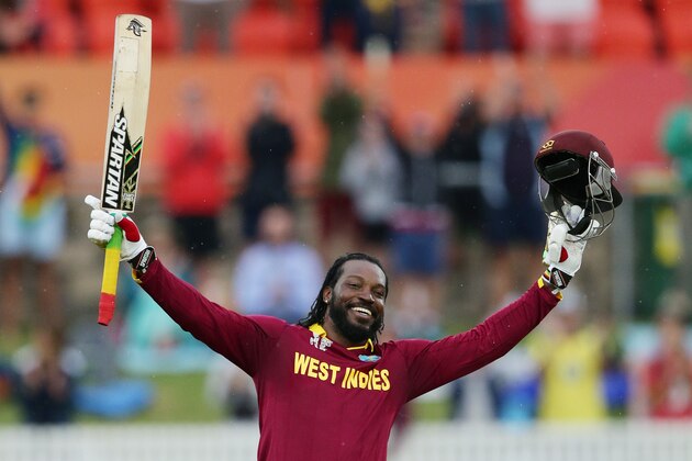 West Indies batsman Chris Gayle celebrates after scoring a double century during their Cricket World  Cup Pool B match against Zimbabwe in Canberra, Australia, Tuesday, Feb. 24, 2015. (AP Photo/Rob Griffith)
