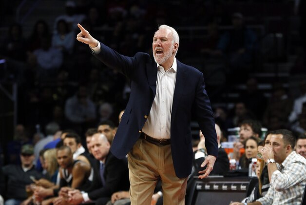 San Antonio Spurs head coach Gregg Popovich gives instructions against the Detroit Pistons in the first half of an NBA basketball game in Auburn Hills, Mich., Wednesday, Feb. 11, 2015. (AP Photo/Paul Sancya)