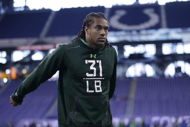 Washington linebacker Shaq Thompson stretches before drills at the NFL football scouting combine in Indianapolis, Sunday, Feb. 22, 2015. (AP Photo/Julio Cortez)