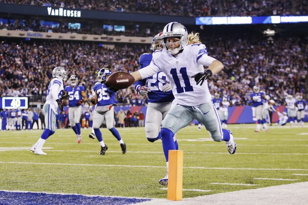 Dallas Cowboys wide receiver Cole Beasley (11) reaches for the goal line as he runs the ball for a touchdown against the New York Giants in the third quarter of an NFL football game, Sunday, Nov. 23, 2014, in East Rutherford, N.J. (AP Photo/Kathy Willens)