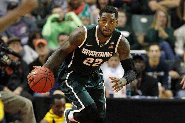 Nov 28, 2014; Kissimmee, FL, USA; Michigan State Spartans guard/forward Branden Dawson (22) drives to the basket against the Marquette Golden Eagles during the second half at HP Field House. Michigan State Spartans defeated the Marquette Golden Eagles 79-68. Mandatory Credit: Kim Klement-USA TODAY Sports