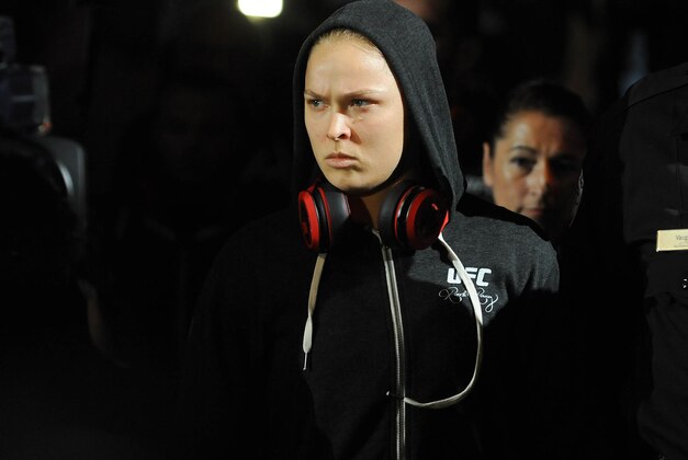 Jul 5, 2014; Las Vegas, NV, USA; Ronda Rousey walks towards the octagon before defending her women's bantamweight title against Alexis Davis at Mandalay Bay Events Center. Mandatory Credit: Stephen R. Sylvanie-USA TODAY Sports