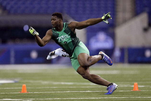 Florida defensive lineman Dante Fowler runs a drill at the NFL football scouting combine in Indianapolis, Sunday, Feb. 22, 2015. (AP Photo/David J. Phillip)