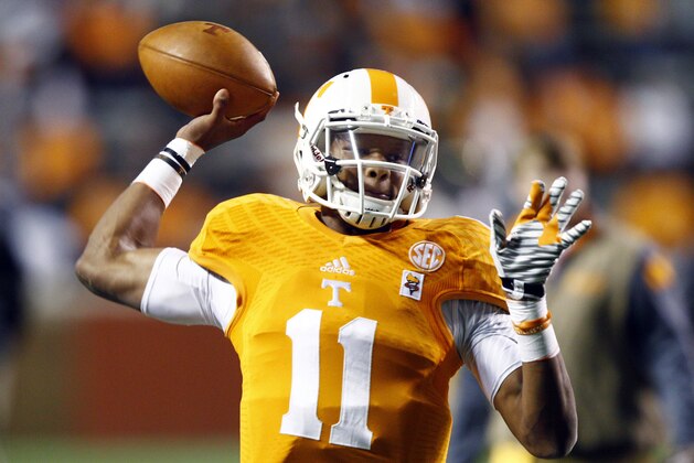 Tennessee quarterback Joshua Dobbs throws during warm ups before an NCAA college football game against Missouri, Saturday, Nov. 22, 2014, in Knoxville, Tenn. (AP Photo/Wade Payne)
