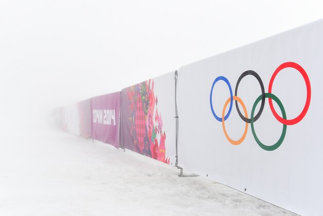 SOCHI, RUSSIA - FEBRUARY 17:  A general view of barriers displaying the Olympic rings in fog during day ten of the Sochi 2014 Winter Olympics at Laura Cross-country Ski & Biathlon Center on February 17, 2014 in Sochi, Russia.  (Photo by Harry How/Getty Images)