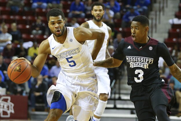 Feb 25, 2015; Starkville, MS, USA; Kentucky Wildcats guard Andrew Harrison (5) brings the ball up court against Mississippi State Bulldogs guard Trivante Bloodman (3) during the game at Humphrey Coliseum. Mandatory Credit: Spruce Derden-USA TODAY Sports