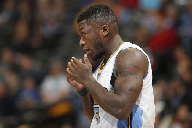 Denver Nuggets guard Nate Robinson looks on against the Orlando Magic in the fourth quarter of an NBA basketball game Wednesday, Jan. 7, 2015, in Denver. The Nuggets defeated the Magic 93-90. (AP Photo/David Zalubowski)