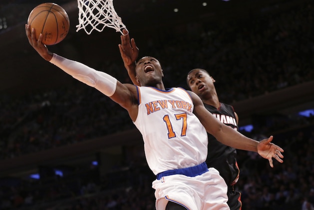 New York Knicks' Cleanthony Early (17) goes up past Miami Heat center Hassan Whiteside on a shot during the second half of an NBA basketball game, Friday, Feb. 20, 2015, at Madison Square Garden in New York. The Heat won 111-87. (AP Photo/Mary Altaffer)
