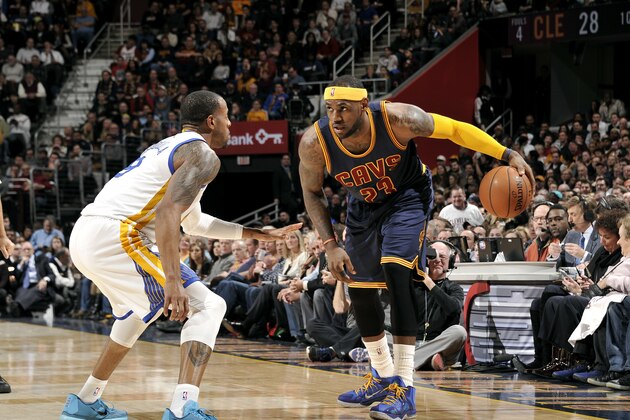 CLEVELAND, OH - FEBRUARY 26: LeBron James #23 of the Cleveland Cavaliers handles the ball against Andre Iguodala #9 of the Golden State Warriors at The Quicken Loans Arena on February 26, 2015 in Cleveland, Ohio. NOTE TO USER: User expressly acknowledges and agrees that, by downloading and/or using this Photograph, user is consenting to the terms and conditions of the Getty Images License Agreement. Mandatory Copyright Notice: Copyright 2015 NBAE (Photo by David Liam Kyle/NBAE via Getty Images)