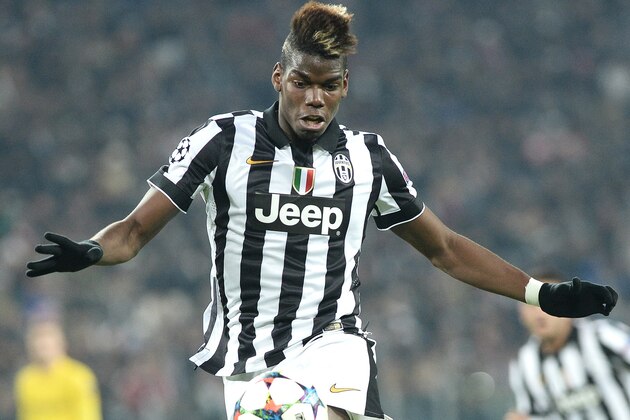 Juventus' Paul Pogba runs with the ball  during the Champions League round of 16 first leg soccer match between Juventus and Borussia Dortmund at the Juventus Stadium, in Turin, Italy, Tuesday, Feb. 24, 2015. (AP Photo/ Massimo Pinca)