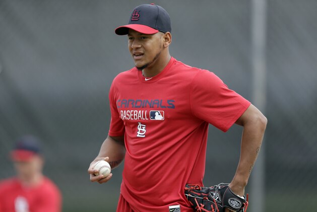 St. Louis Cardinals pitcher Carlos Martinez throws a bullpen session during spring training baseball practice Wednesday, Feb. 18, 2015, in Jupiter, Fla. Cardinals pitchers and catchers have their first official workout scheduled for Friday. (AP Photo/Jeff Roberson)