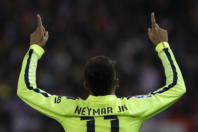 Barcelona's Neymar celebrates his second goal during a second leg quarterfinal Copa del Rey soccer match between Atletico de Madrid and FC Barcelona at the Vicente Calderon stadium in Madrid, Spain, Wednesday, Jan. 28, 2015. (AP Photo/Andres Kudacki)