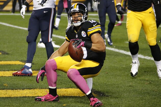Pittsburgh Steelers wide receiver Lance Moore (16) celebrates after making a touchdown catch from wide receiver Antonio Brown (84) in front of Houston Texans cornerback Johnathan Joseph (24) in the second quarter of the NFL football game, Monday, Oct. 20, 2014 in Pittsburgh. (AP Photo/Gene Puskar)