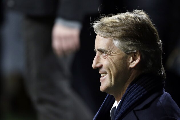 Inter Milan coach Roberto Mancini smiles during a Uefa Europa League, round of 32 second leg soccer match between Inter Milan and Celtic at the San Siro stadium in Milan, Italy, Thursday, Feb. 26, 2015. (AP Photo/Luca Bruno)