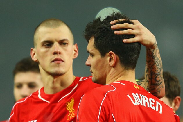 ISTANBUL, TURKEY - FEBRUARY 26:  Dejan Lovren of Liverpool is consoled by Martin Skrtel (L) as he misses the decisive kick in the penalty shoot out during the UEFA Europa League Round of 32 second leg match between Besiktas JK and Liverpool FC on February 26, 2015 in Istanbul, Turkey.  (Photo by Richard Heathcote/Getty Images)