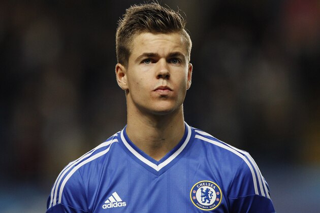 Chelsea's Marco van Ginkel looks on during a line up before the start of their Champions League group E soccer match against Basel at Stamford Bridge stadium in London, Wednesday, Sept. 18, 2013. (AP Photo/Sang Tan)