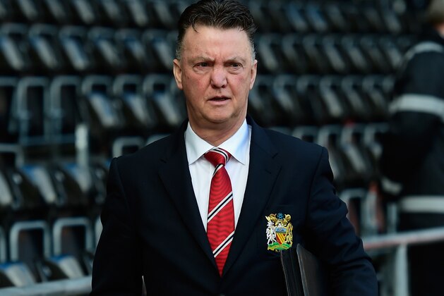 SWANSEA, WALES - FEBRUARY 21:  Manchester United manager Louis Van Gaal (l) waves to the fans before the Barclays Premier League match between Swansea City and Manchester United at Liberty Stadium on February 21, 2015 in Swansea, Wales.  (Photo by Stu Forster/Getty Images)