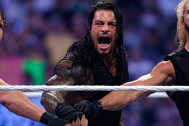 The Shield reacts after their win during Wrestlemania XXX at the Mercedes-Benz Super Dome in New Orleans on Sunday, April 6, 2014. (Jonathan Bachman/AP Images for WWE)