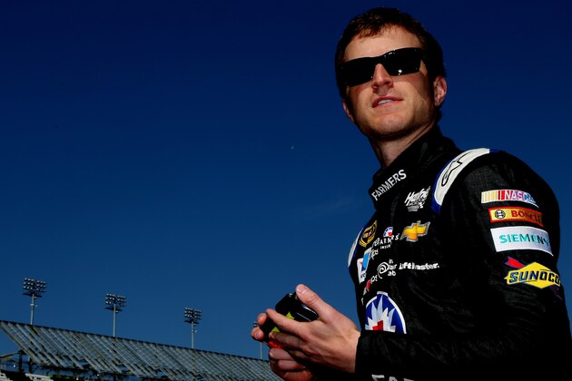 DAYTONA BEACH, FL - FEBRUARY 15:  Kasey Kahne, driver of the #5 Farmers Insurance Chevrolet, stands on the grid during qualifying for the 57th Annual Daytona 500 at Daytona International Speedway on February 15, 2015 in Daytona Beach, Florida.  (Photo by Jerry Markland/Getty Images)