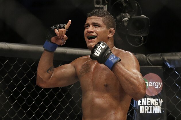 Gilbert Burns celebrates after beating Andreas Stahl by unanimous decision in a welterweight mixed martial arts bout at a UFC on Fox event in San Jose, Calif., Saturday, July 26, 2014. (AP Photo/Jeff Chiu)