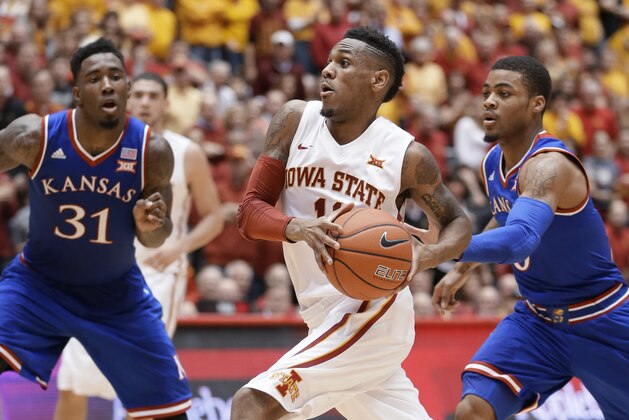 Iowa State guard Monte Morris, center, drives to the basket between Kansas' Jamari Traylor, left, and Frank Mason III, right, during the first half of an NCAA college basketball game, Saturday, Jan. 17, 2015, in Ames, Iowa. (AP Photo/Charlie Neibergall) Iowa State guard Monte Morris, center, drives to the basket between Kansas' Jamari Traylor, left, and Frank Mason III, right, during the first half of an NCAA college basketball game, Saturday, Jan. 17, 2015, in Ames, Iowa. (AP Photo/Charlie Neibergall)