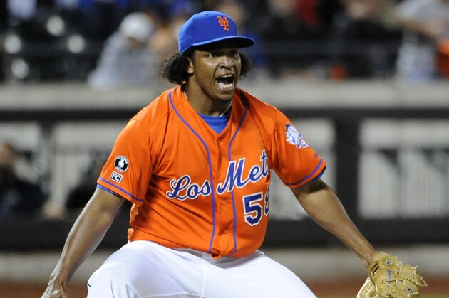 New York Mets relief pitcher Jenrry Mejia celebrates the Mets' 4-3 win over the Washington Nationals in a baseball game Friday, Sept. 12, 2014, in New York. (AP Photo/Kathy Kmonicek)