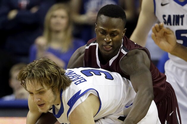 Saint Louis' Jake Barnett, front, and Fordham's Bryan Smith reach for a loose ball during the second half of an NCAA college basketball game Saturday, Jan. 18, 2014, in St. Louis. Saint Louis won 70-48. (AP Photo/Jeff Roberson)