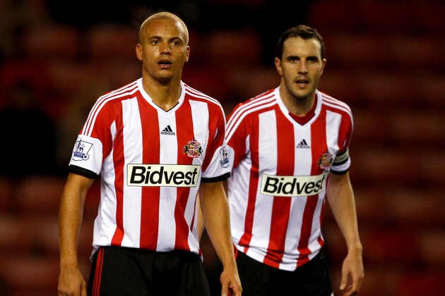SUNDERLAND,ENGLAND-NOVEMBER 06:  Wes Brown (L) and John O'Shea of Sunderland during the Capital One Cup fourth Round match between Sunderland and Southampton at Stadium of Light on November 06, 2013 in Sunderland, England. (Photo by Richard Sellers/Getty Images)