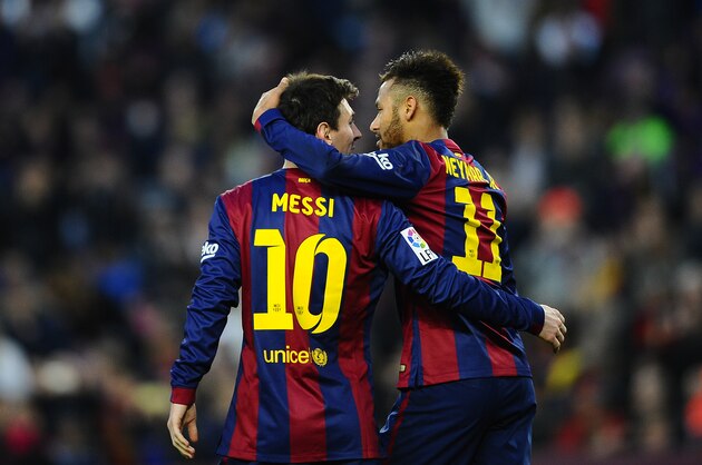 FC Barcelona's Lionel Messi, from Argentina, left, reacts after scoring with his teammate Neymar, from Brazil, against Levante during a Spanish La Liga soccer match at the Camp Nou stadium in Barcelona, Spain, Sunday, Feb. 15, 2015. (AP Photo/Manu Fernandez)