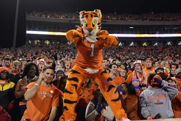 Clemson's mascot, the Tiger, and fans celebrate the team's 55-31 win over Georgia Tech during the second half of an NCAA college football game Thursday, Nov.14, 2013, at Memorial Stadium in Clemson, S.C.(AP Photo/ Richard Shiro)