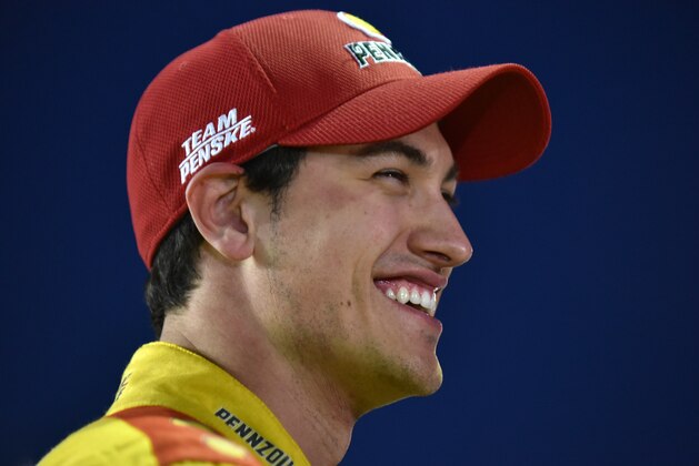 HAMPTON, GA - FEBRUARY 27: Joey Logano, driver of the #22 Shell Pennzoil Ford, stands on the grid during qualifying for the NASCAR Sprint Cup Series  Folds of Honor QuikTrip 500 at Atlanta Motor Speedway on February 27, 2015 in Hampton, Georgia.  (Photo by Jonathan Moore/Getty Images)