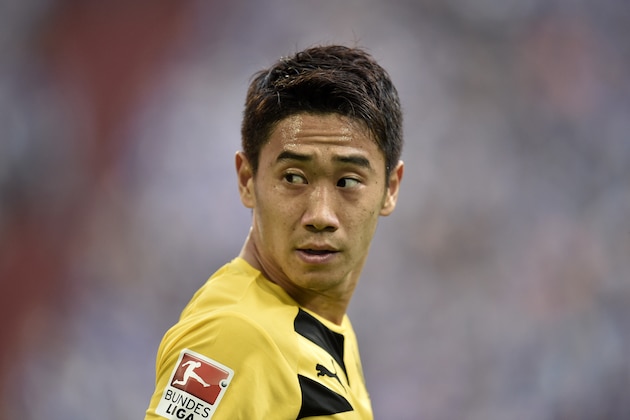 Dortmund's Shinji Kagawa from Japan watches during the German Bundesliga soccer match between FC Schalke 04 and Borussia Dortmund in Gelsenkirchen, Germany, Saturday, Sept. 27, 2014. Schalke won the derby with 2-1. (AP Photo/Martin Meissner)
