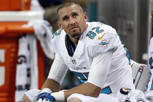 Miami Dolphins wide receiver Brian Hartline (82) watches from the bench against the Detroit Lions in the fourth quarter of a NFL football game in Detroit Sunday, Nov. 9, 2014. Detroit won 20-16. (AP Photo/Paul Sancya)