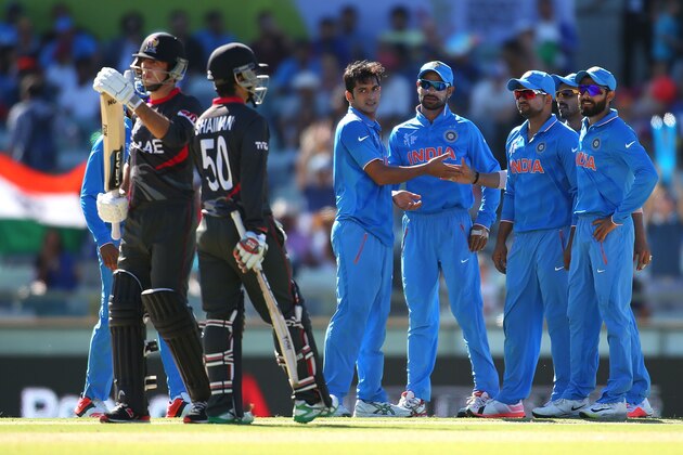 PERTH, AUSTRALIA - FEBRUARY 28: Mohit Sharmar of India celebrates with team mates after dismissing Rohan Mustafa of the UAE during the 2015 ICC Cricket World Cup match between India and the United Arab Emirates at WACA on February 28, 2015 in Perth, Australia.  (Photo by Paul Kane/Getty Images)