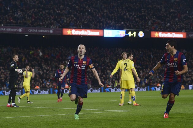 FC Barcelona's Andres Iniesta celebrates scoring against Villarreal during the semifinal, first leg, Copa del Rey soccer match at the Camp Nou stadium in Barcelona, Spain, Wednesday, Feb. 11, 2015. (AP Photo/Manu Fernandez)
