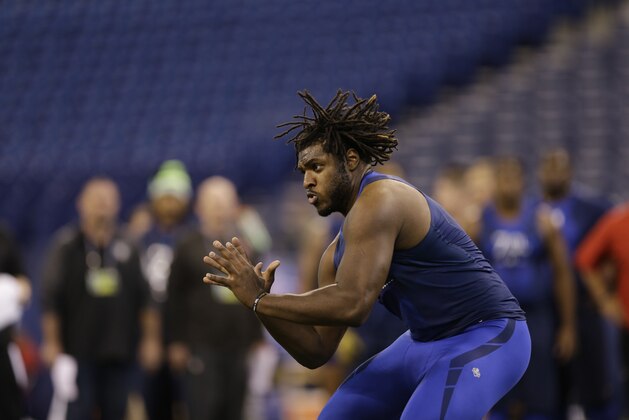 Pittsburgh offensive lineman T.J. Clemmings (6) runs a drill at the NFL football scouting combine in Indianapolis, Friday, Feb. 20, 2015. (AP Photo/David J. Phillip)