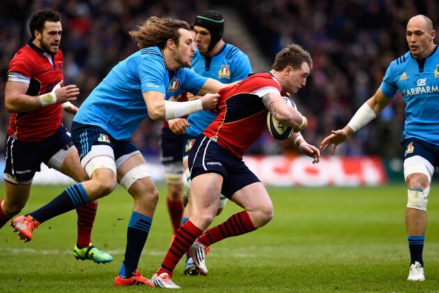 EDINBURGH, SCOTLAND - FEBRUARY 28:  Italy player Joshua Furno (l) grabs hold of Scotland full back Stuart Hogg during the RBS Six Nations match between Scotland and Italy at Murrayfield Stadium on February 28, 2015 in Edinburgh, Scotland.  (Photo by Stu Forster/Getty Images)
