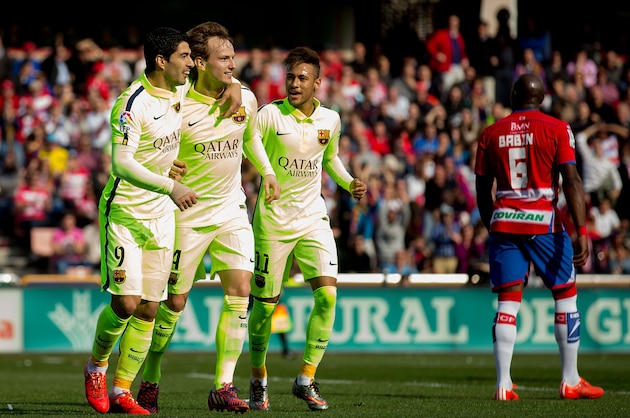 GRANADA, SPAIN - FEBRUARY 28:  Ivan Rakitic (2ndL) of FC Barcelona celebrates scoring their opening goal with team mates Luis Suarez (L) and Neymar JR. (R) during the La Liga match between Granada CF and FC Barcelona at Nuevo Estadio de los Carmenes on February 28, 2015 in Granada, Spain.  (Photo by Gonzalo Arroyo Moreno/Getty Images)