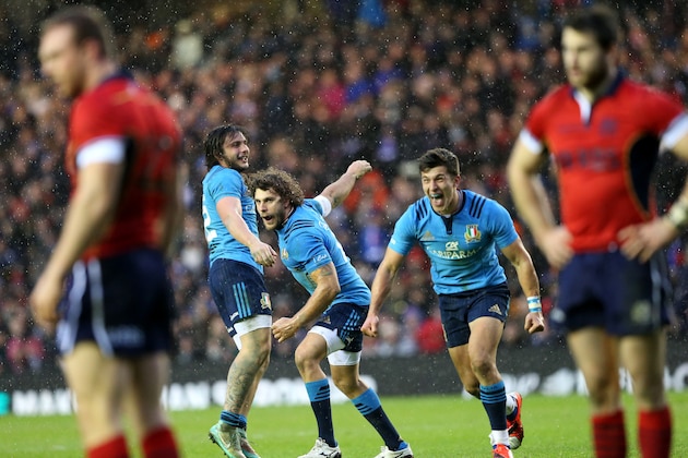 Italy's Michele Visentin, center, Enrico Bacchin , left, and Tommaso Allan , right, celebrate their victory over Scotland at the end of their Six Nations rugby union international match at Murrayfield stadium, Edinburgh, Scotland, Saturday Feb. 28, 2015. (AP Photo/Scott Heppell)