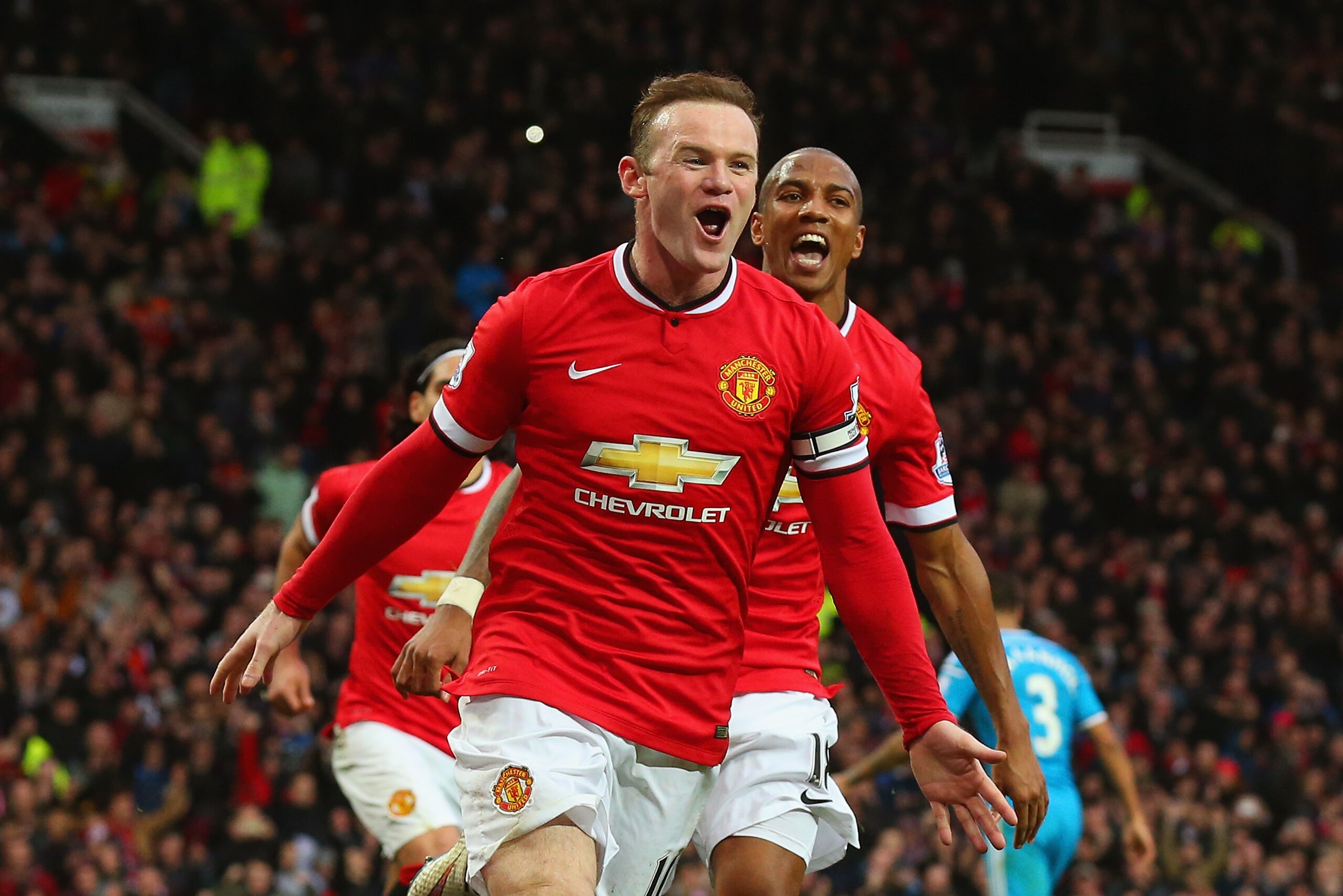 MANCHESTER, ENGLAND - FEBRUARY 28:  Wayne Rooney of Manchester United celebrates scoring the opening goal with Ashley Young of Manchester United during the Barclays Premier League match between Manchester United and Sunderland at Old Trafford on February 28, 2015 in Manchester, England.  (Photo by Alex Livesey/Getty Images)