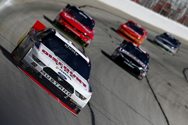 HAMPTON, GA - FEBRUARY 28:  Joey Logano, driver of the #22 Discount Tire Ford, leads the field during the NASCAR XFINITY Series Hisense 250 at Atlanta Motor Speedway on February 28, 2015 in Hampton, Georgia.  (Photo by Kevin C. Cox/Getty Images)
