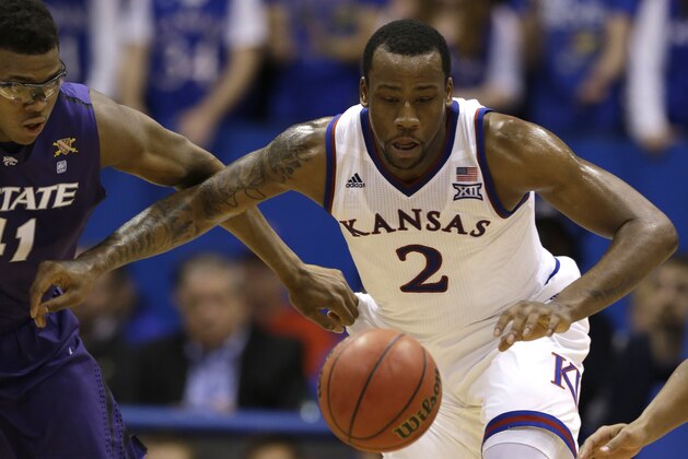 Kansas forward Cliff Alexander (2) and Kansas State forward Stephen Hurt (41) during the first half of an NCAA college basketball game in Lawrence, Kan., Saturday, Jan. 31, 2015. (AP Photo/Orlin Wagner)