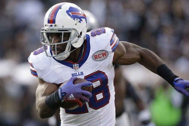 Buffalo Bills running back C.J. Spiller (28) runs against the Oakland Raiders during the second quarter of an NFL football game in Oakland, Calif., Sunday, Dec. 21, 2014. (AP Photo/Marcio Jose Sanchez)