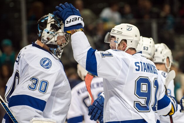 Feb 15, 2015; San Jose, CA, USA; Tampa Bay Lightning goalie Ben Bishop (30) celebrates with center Steven Stamkos (91) after defeating the San Jose Sharks 5-2 at SAP Center at San Jose. Mandatory Credit: Ed Szczepanski-USA TODAY Sports