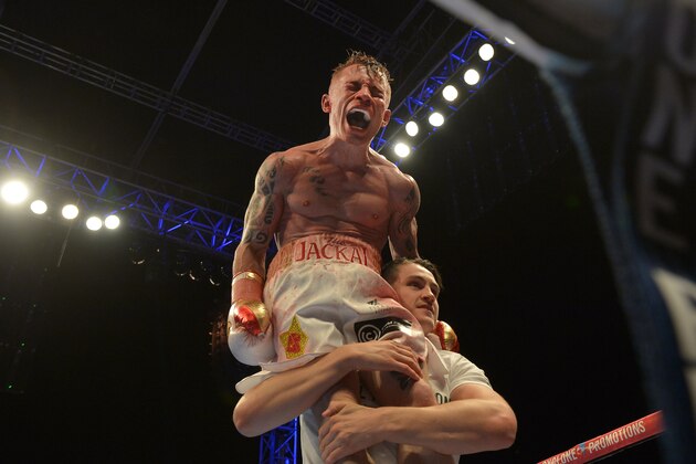 BELFAST, NORTHERN IRELAND - SEPTEMBER 6: The new IBF super-bantamweight world champion Carl Frampton of Northern Ireland celebrates after his victory over Kiko Martinez of Spain, at the purpose-built 16,000 capacity Titanic slipway outdoor arena on September 6, 2014 in Belfast, Northern Ireland. (Photo by Charles McQuillan/Getty Images).