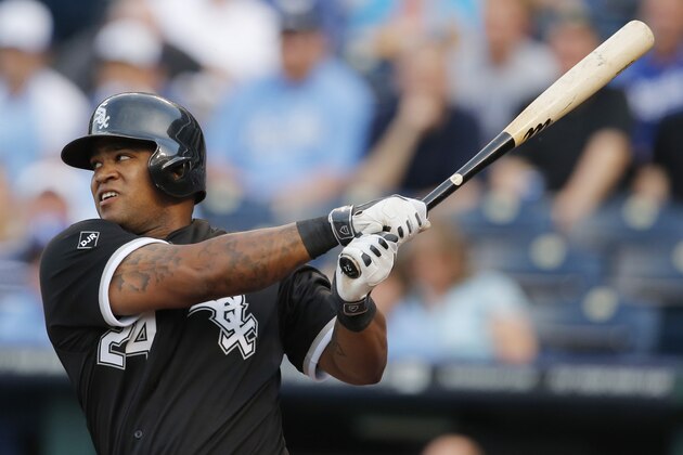 Chicago White Sox's Dayan Viciedo follows through on an RBI single off Kansas City Royals starting pitcher Yordano Ventura during the first inning of a baseball game at Kauffman Stadium in Kansas City, Mo., Tuesday, May 20, 2014. (AP Photo/Orlin Wagner)