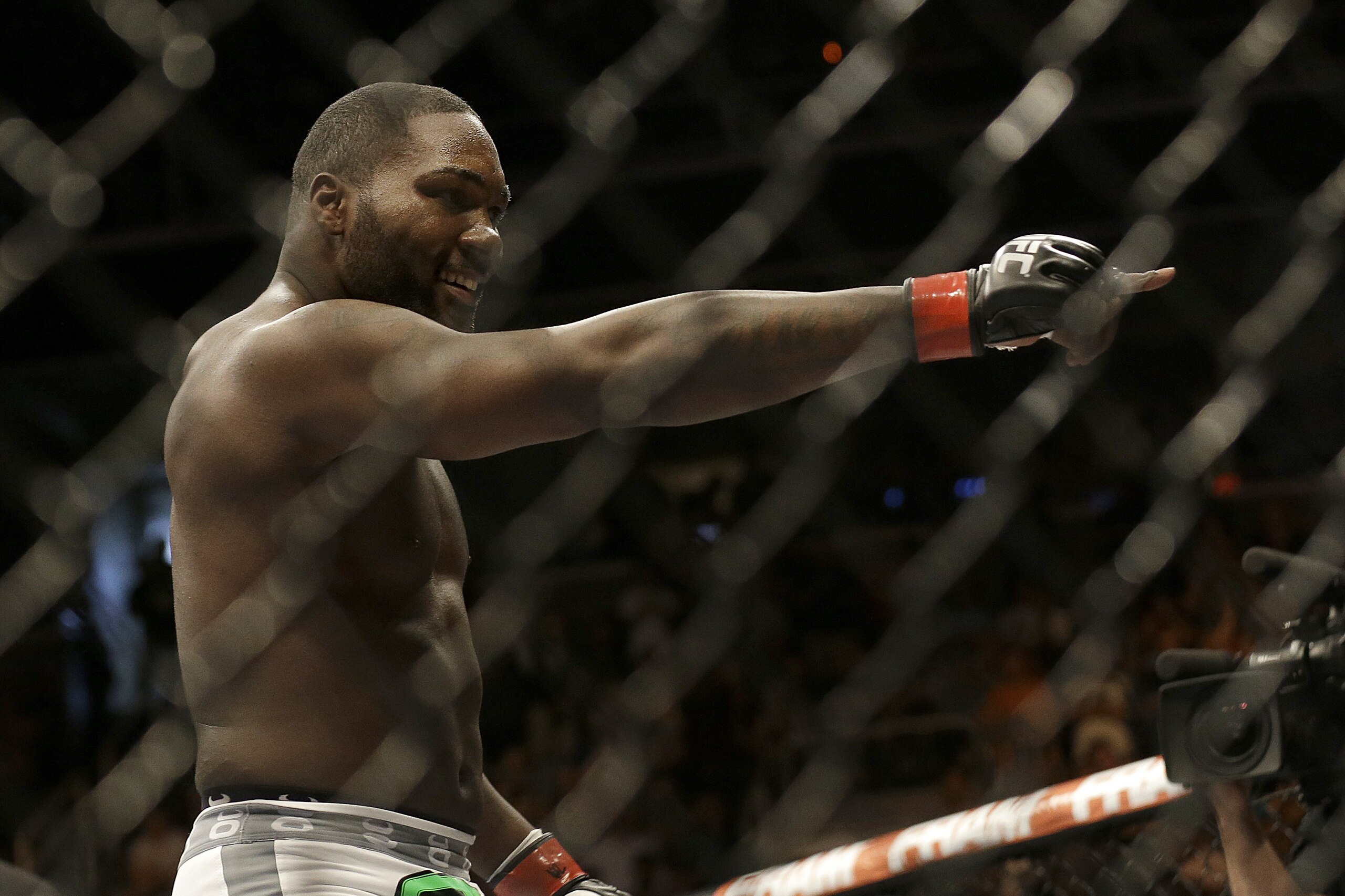 Anthony Johnson celebrates after beating Antonio Rogerio Nogueira by technical knockout during the first round of a light heavyweight mixed martial arts bout at a UFC on Fox event in San Jose, Calif., Saturday, July 26, 2014. (AP Photo/Jeff Chiu)